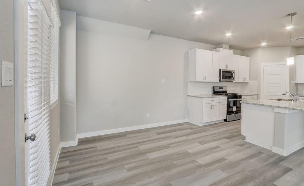 8403 Arden Valley Lane Houston, TX 77063 - Photo 14 of 32 a view of kitchen with wooden floor