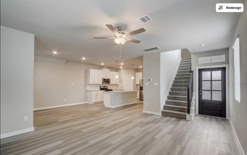 8403 Arden Valley Lane Houston, TX 77063 - Photo 2 of 32 a view of a kitchen with wooden floor and a ceiling fan