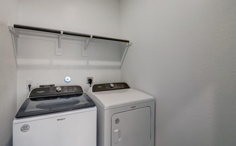 8403 Arden Valley Lane Houston, TX 77063 - Photo 23 of 32 a utility room with dryer and washer