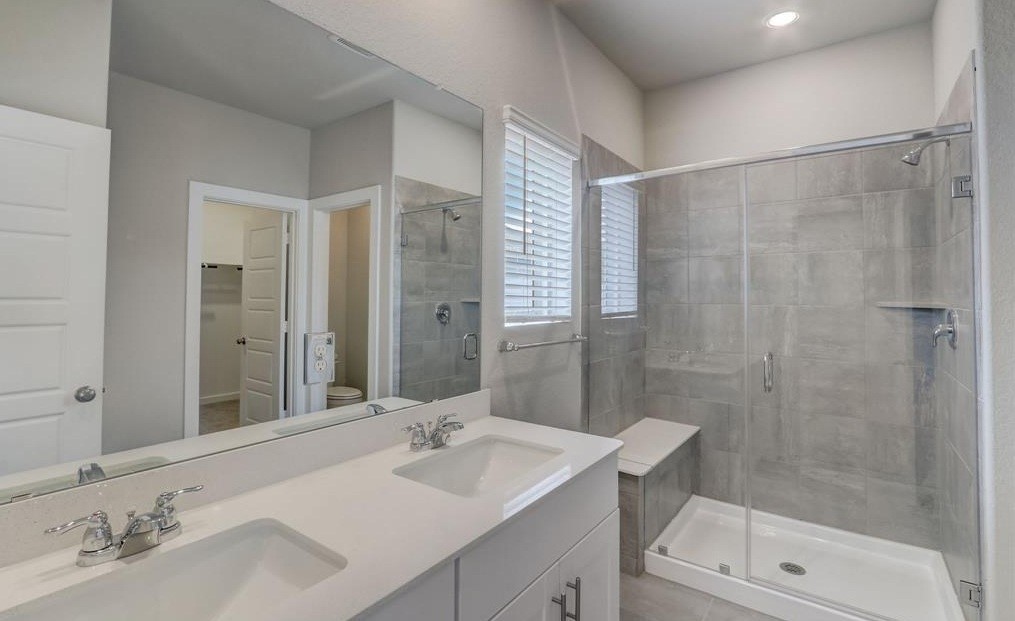 8403 Arden Valley Lane Houston, TX 77063 - Photo 28 of 32 a bathroom with a sink shower and a mirror