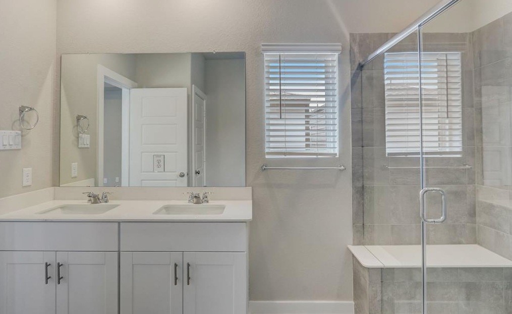 8403 Arden Valley Lane Houston, TX 77063 - Photo 29 of 32 a bathroom with a sink and a mirror