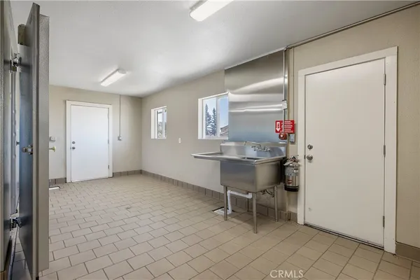 a bathroom with a granite countertop toilet and a shower