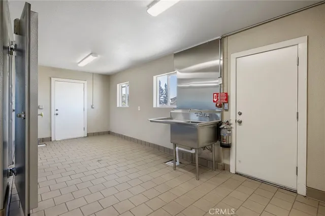 a bathroom with a granite countertop toilet and a shower