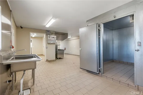 a spacious bathroom with a sink and a mirror