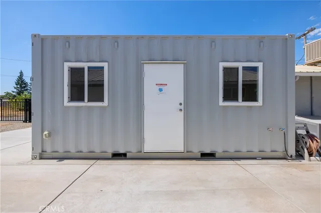 a bedroom with furniture and a ceiling fan