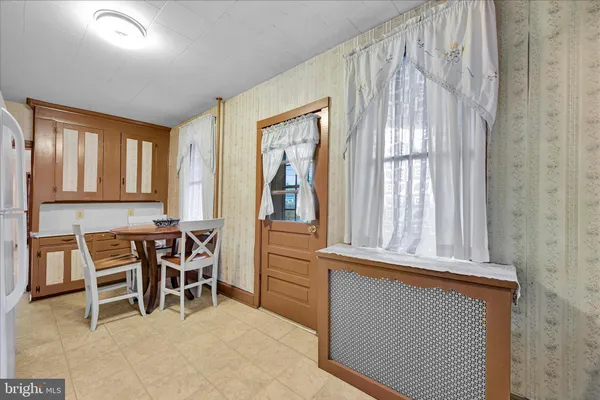 a view of a room with furniture and windows