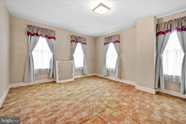 a view of an empty room and window