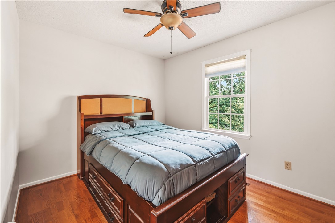 2001 Ridgeview Lane Seneca, SC 29678 - Photo 19 of 27 Hardwood floors and a bright window with tree-filled views distinguish this inviting bedroom.