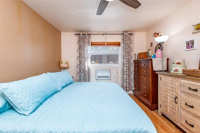 a bedroom with furniture and a window