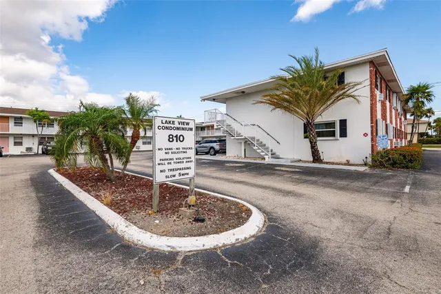 a view of a patio with table and chairs