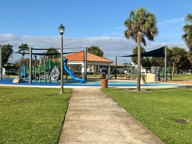 a front view of a building with garden