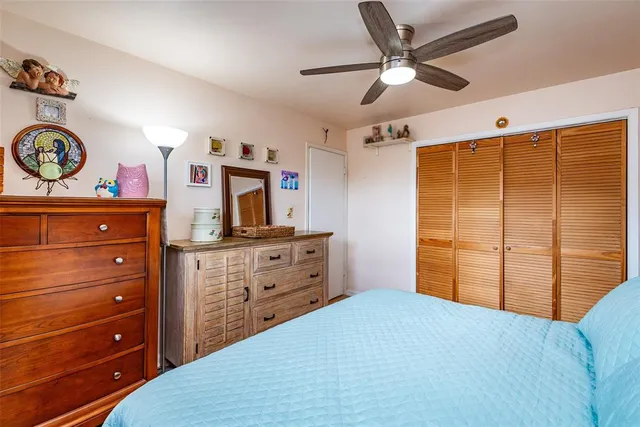 a bedroom with a bed and a dresser