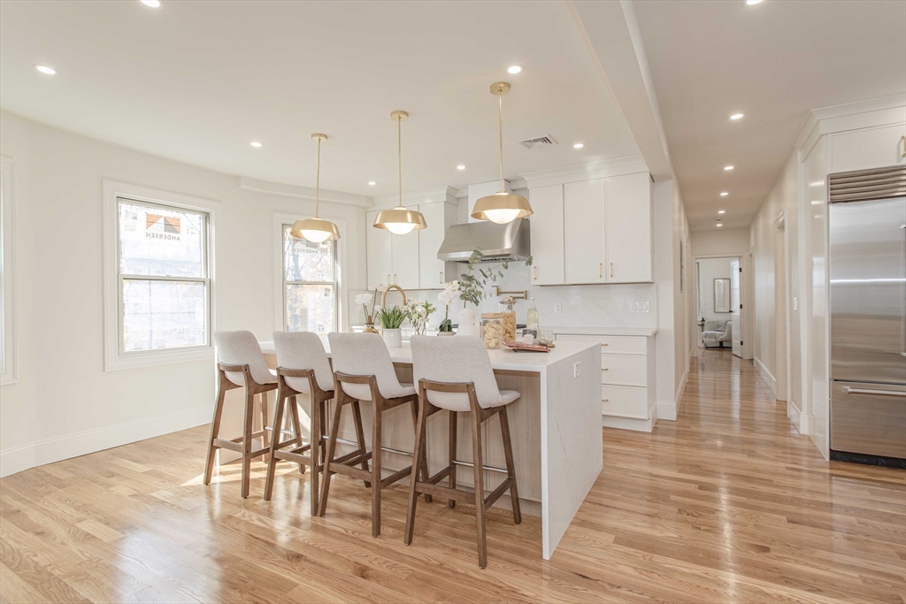 125 Mt Vernon Street, Unit 2 Newton, MA 02465 - Photo 6 of 36 a view of a dining room with furniture and wooden floor