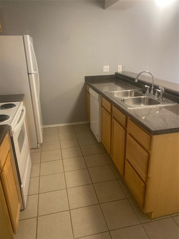8114 Sonnet Avenue, Unit 102 Austin, TX 78759 - Photo 4 of 12 a bathroom with a granite countertop sink and a mirror