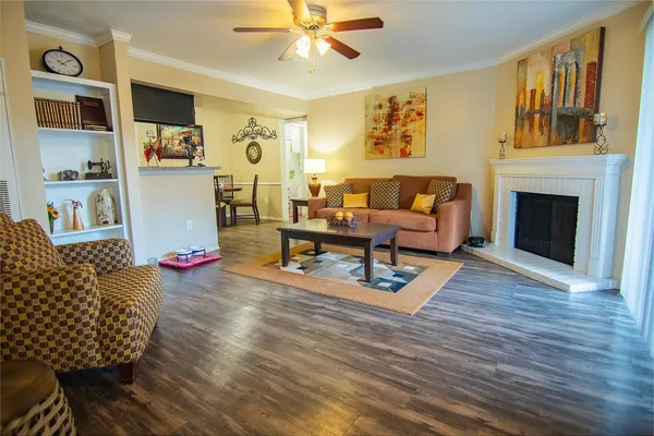 a living room with furniture and a fireplace