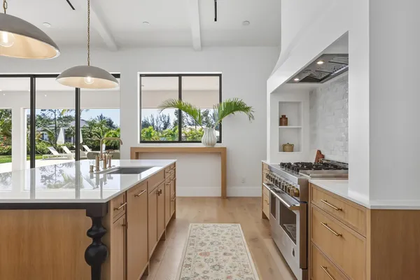 a kitchen with a stove and a sink