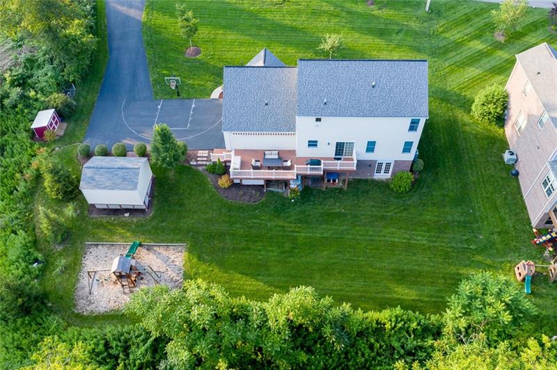 2317 Mcdevitt Road Sewickley, PA 15143 - Photo 20 of 25 Overhead view of the property from the rear -- showing house, two storage sheds, playground set and flat backyard.