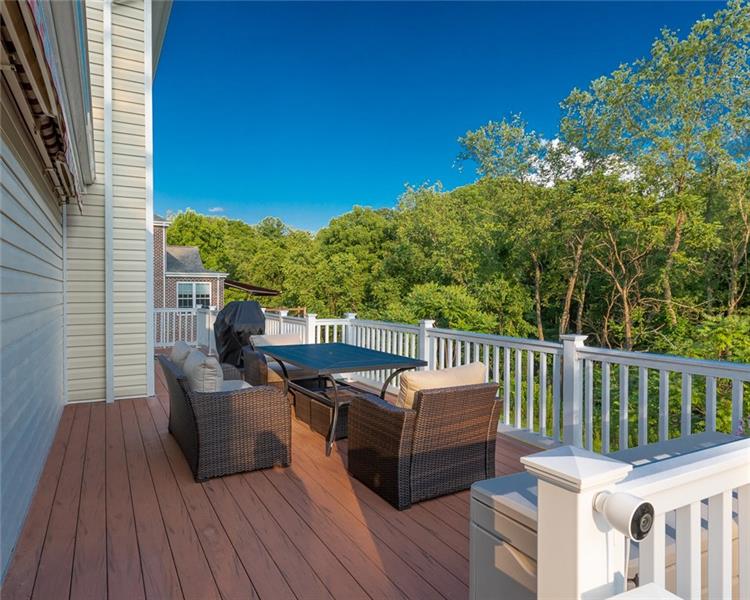 2317 Mcdevitt Road Sewickley, PA 15143 - Photo 22 of 25 Rear deck with awning closed. Private setting with woods behind the home.