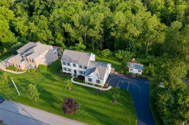 2317 Mcdevitt Road Sewickley, PA 15143 - Photo 25 of 25 Aerial view showing neighboring home and wooded hillside behind the home that cannot be built on.