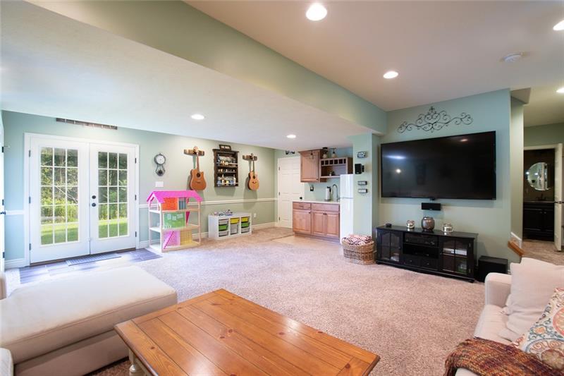 2317 Mcdevitt Road Sewickley, PA 15143 - Photo 9 of 25 Huge finished basement, with a bar, that walks out to flat backyard