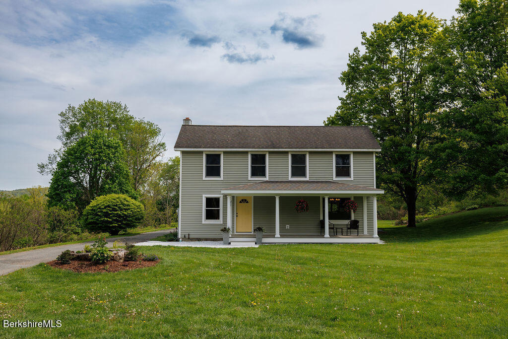 45 State Line Road West Stockbridge, MA 01266 - Photo 1 of 34 a front view of a house with a garden