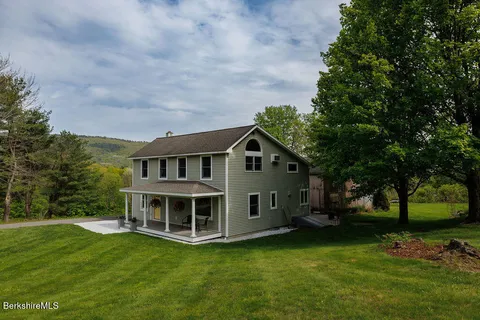 a view of a house with a big yard