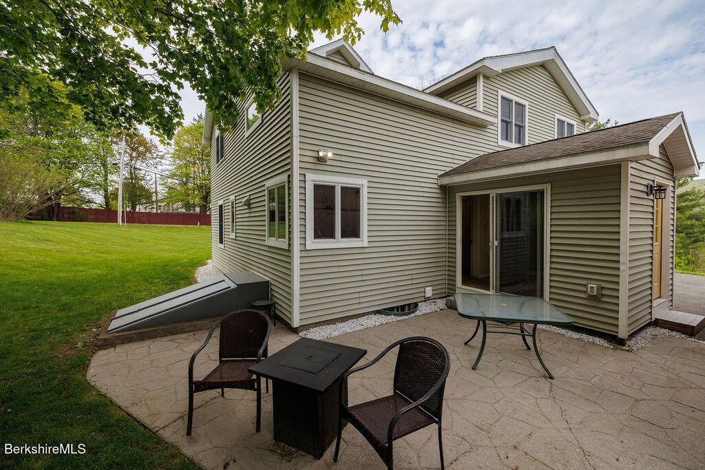 45 State Line Road West Stockbridge, MA 01266 - Photo 28 of 34 a backyard of a house with table and chairs