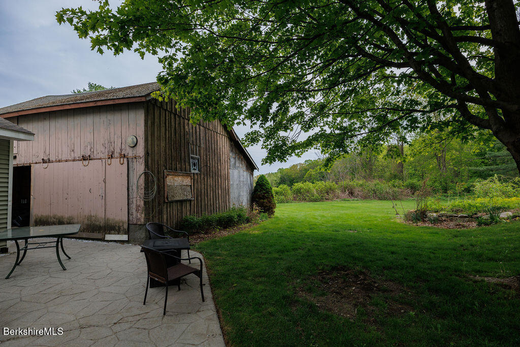 45 State Line Road West Stockbridge, MA 01266 - Photo 30 of 34 a backyard of a house with table and chairs