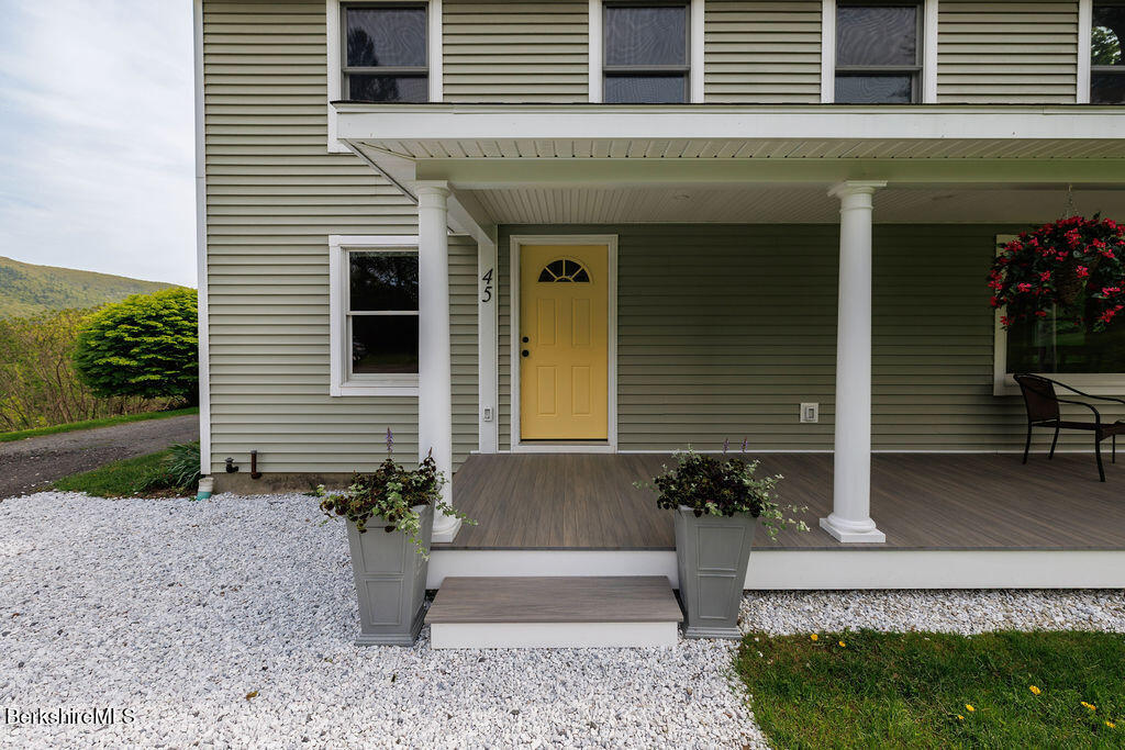 45 State Line Road West Stockbridge, MA 01266 - Photo 3 of 34 a front view of a house with garden