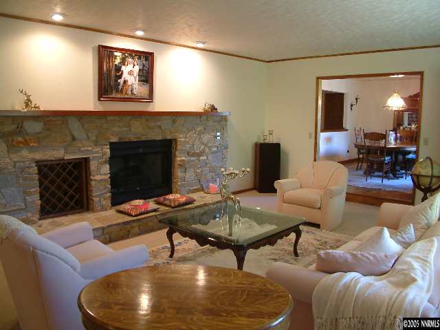 1635 Heitman Court Reno, NV 89509 - Photo 3 of 9 a living room with furniture and a fireplace