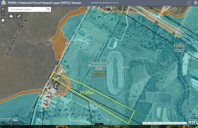 a backyard of a house with lots of green space and forest