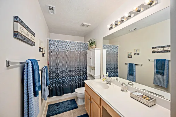 a living room filled with furniture and a floor to ceiling window