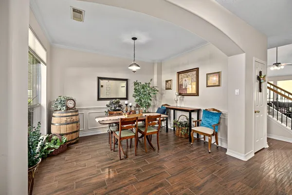 a view of a dining room with furniture window and wooden floor