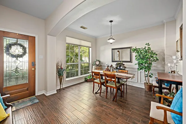 a view of a dining room with furniture window and wooden floor