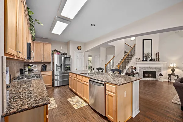 a view of a a dining room with furniture window and wooden floor