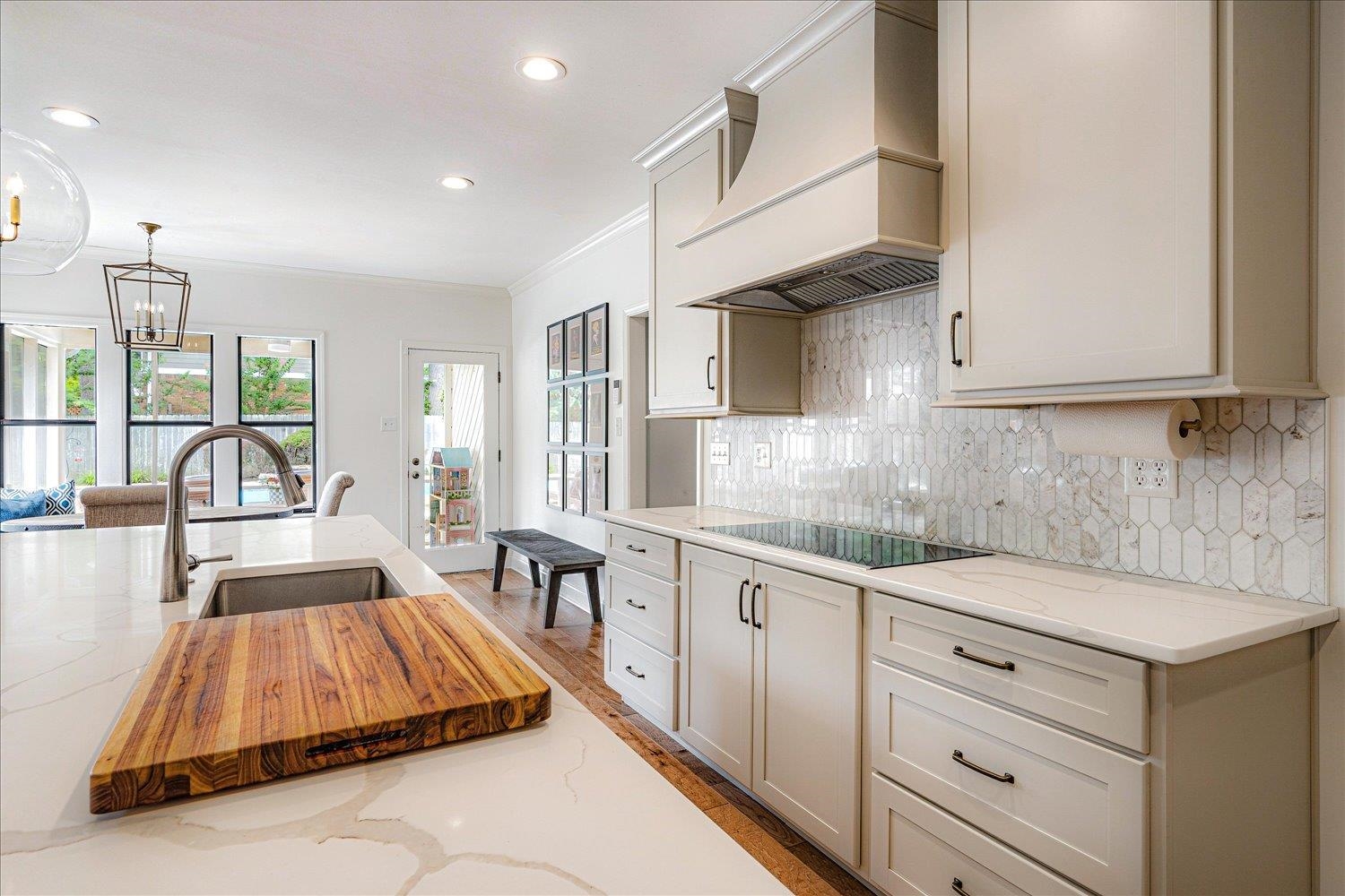 6677 Neshoba Road Memphis, TN 38120 - Photo 19 of 40 a kitchen with granite countertop a sink and white cabinets