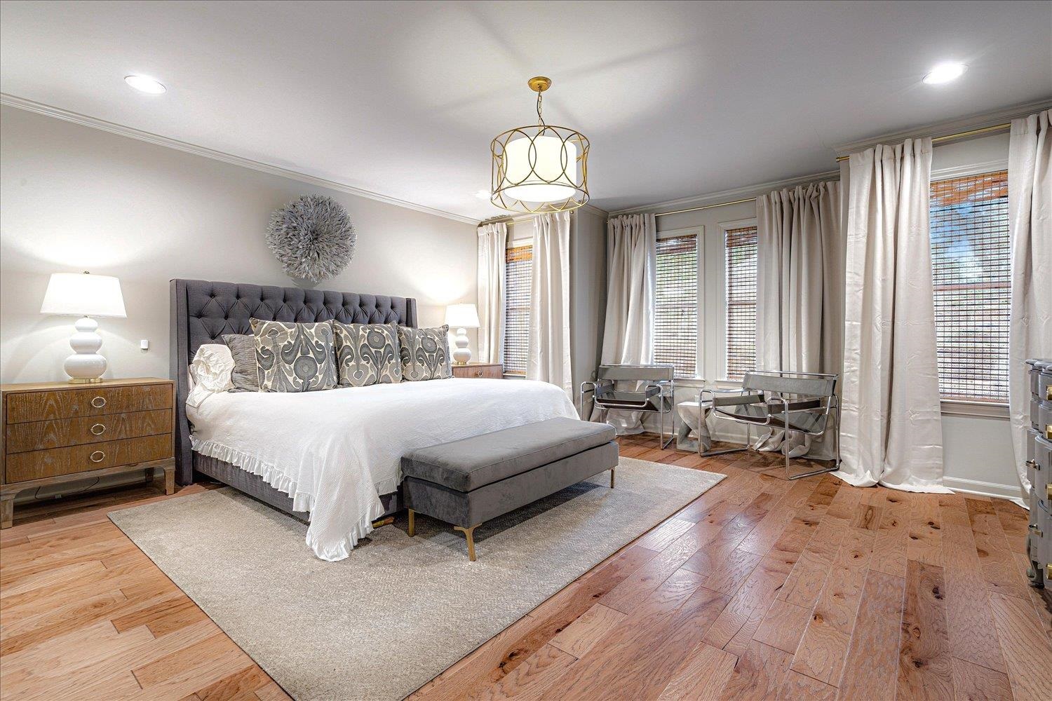 6677 Neshoba Road Memphis, TN 38120 - Photo 25 of 40 a bed room with a bed and a chandelier