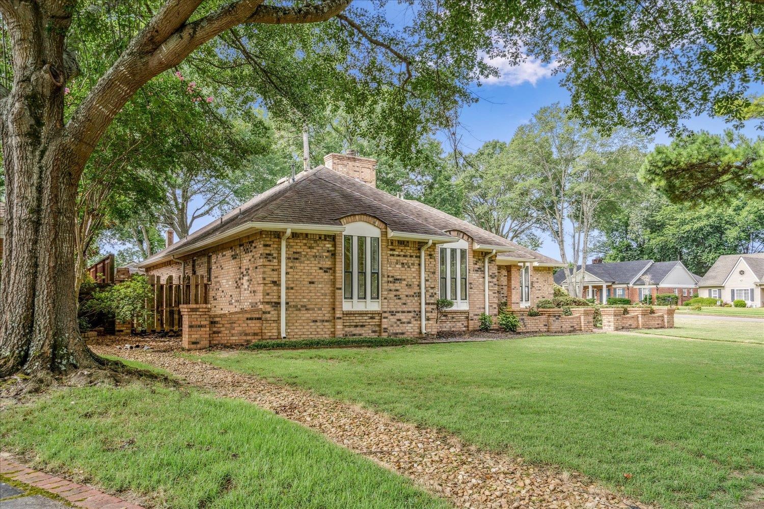 6677 Neshoba Road Memphis, TN 38120 - Photo 3 of 40 a view of a house with a yard
