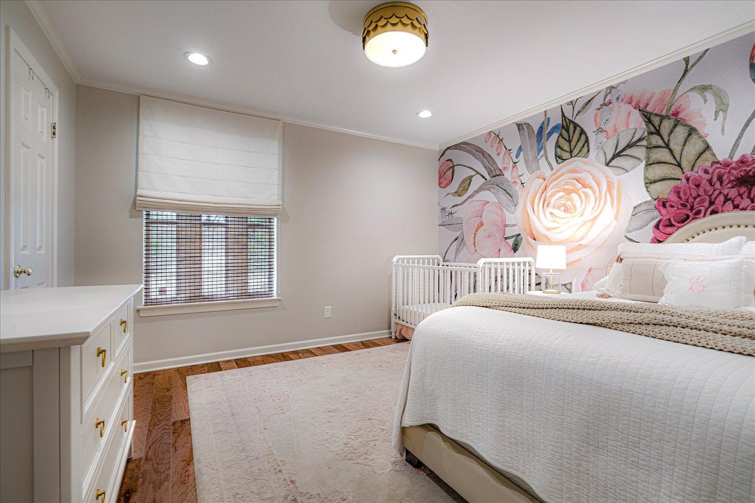 6677 Neshoba Road Memphis, TN 38120 - Photo 30 of 40 a spacious bedroom with a bed and a window in it