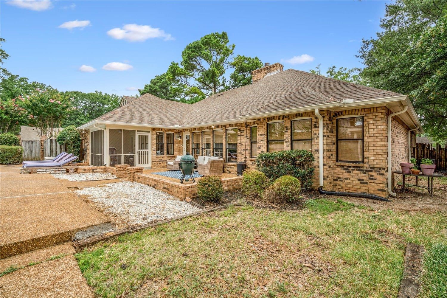6677 Neshoba Road Memphis, TN 38120 - Photo 34 of 40 a front view of a house with garden