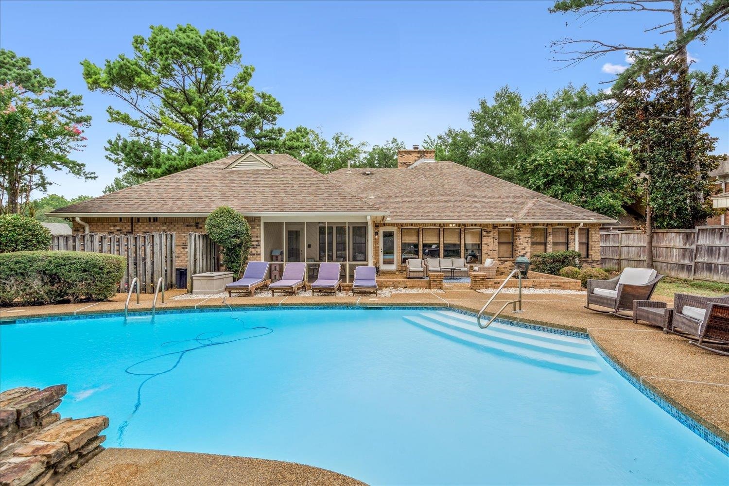 6677 Neshoba Road Memphis, TN 38120 - Photo 35 of 40 a front view of a house with swimming pool having outdoor seating