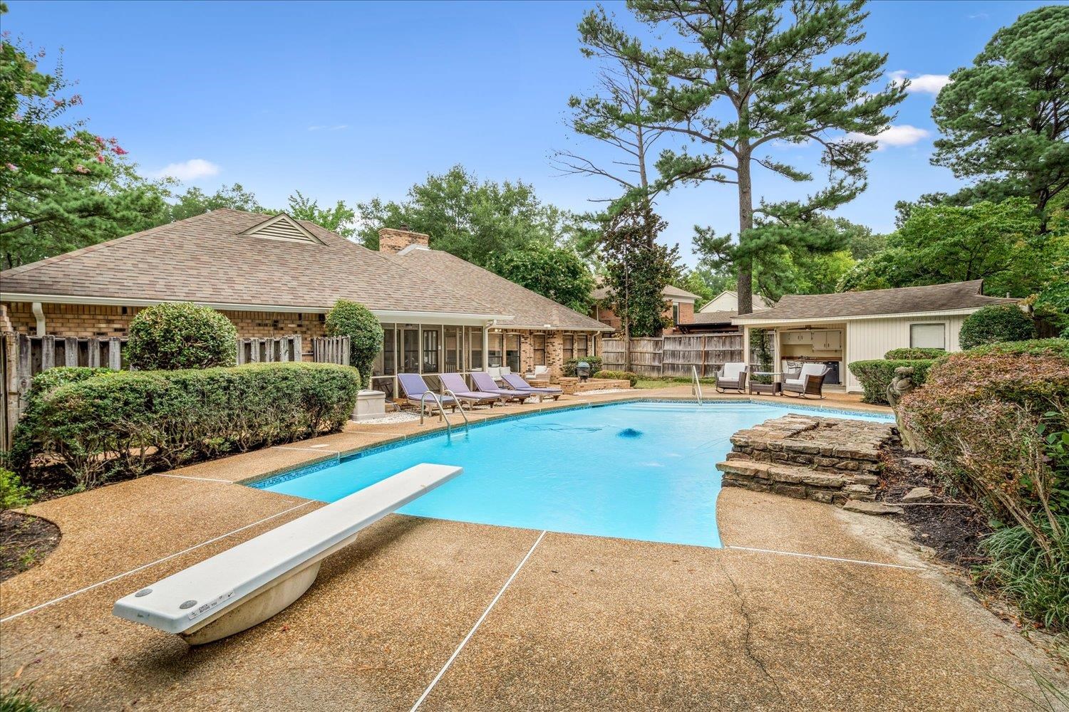 6677 Neshoba Road Memphis, TN 38120 - Photo 36 of 40 a view of a house with swimming pool and sitting area