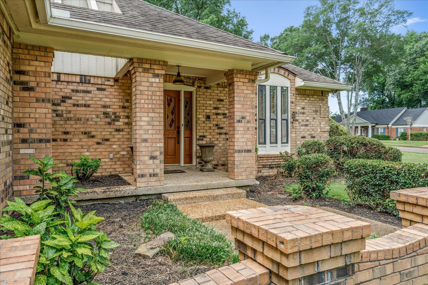 6677 Neshoba Road Memphis, TN 38120 - Photo 5 of 40 a front view of a house with garden