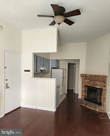 a view of a livingroom with furniture and a fireplace