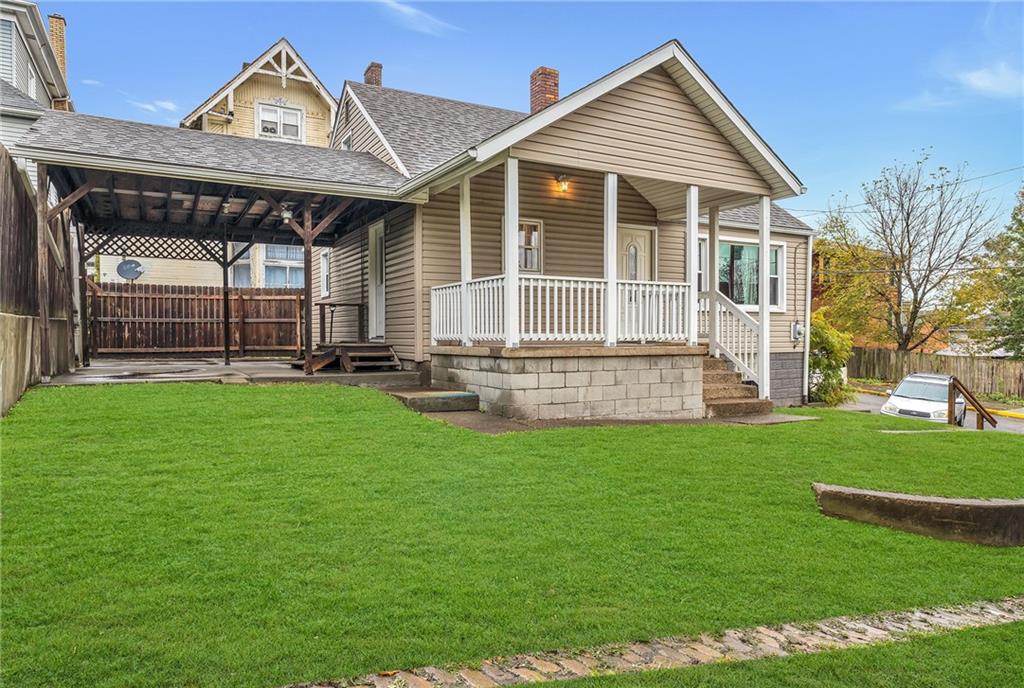 290 Jackson Street Rochester, PA 15074 - Photo 2 of 16 a view of a house with a yard and sitting area