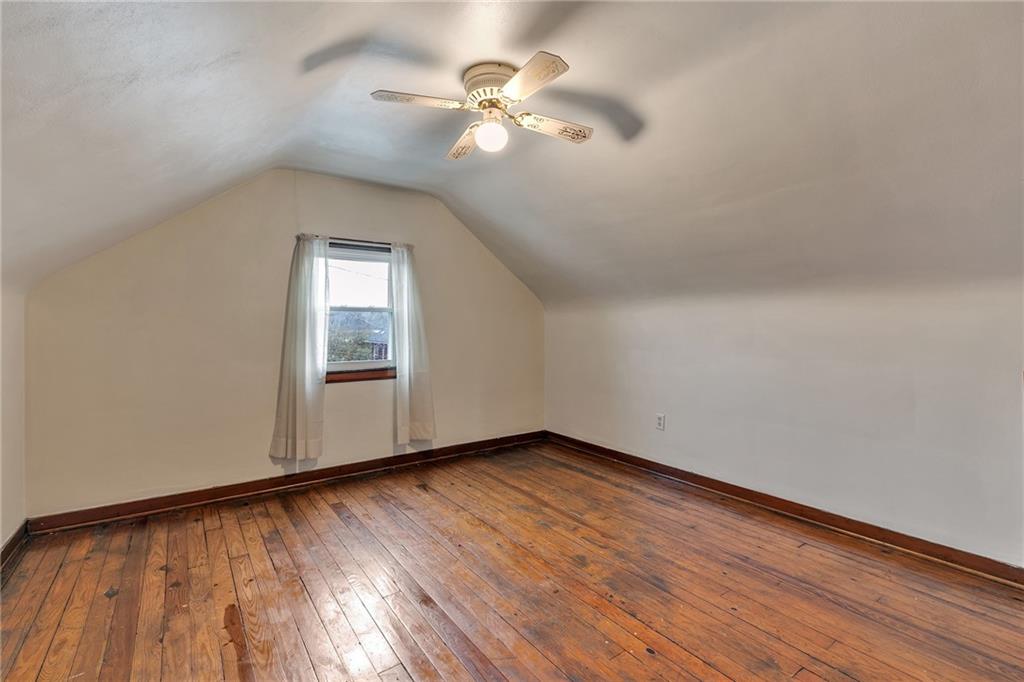 290 Jackson Street Rochester, PA 15074 - Photo 11 of 16 wooden floor in an empty room with a window
