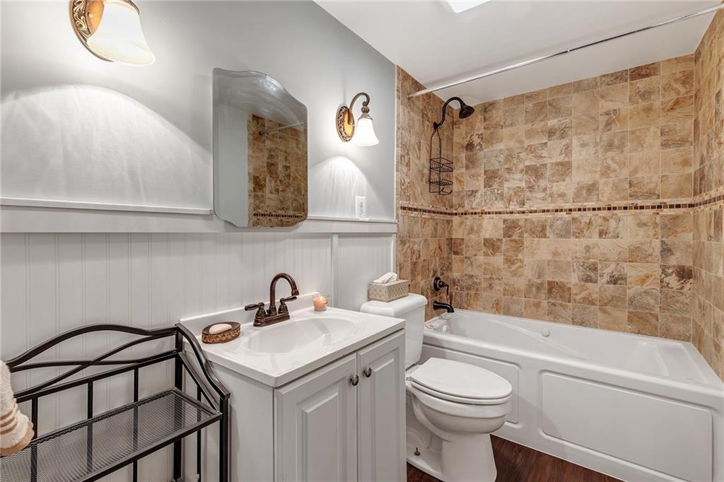 290 Jackson Street Rochester, PA 15074 - Photo 9 of 16 a bathroom with a sink a toilet and shower