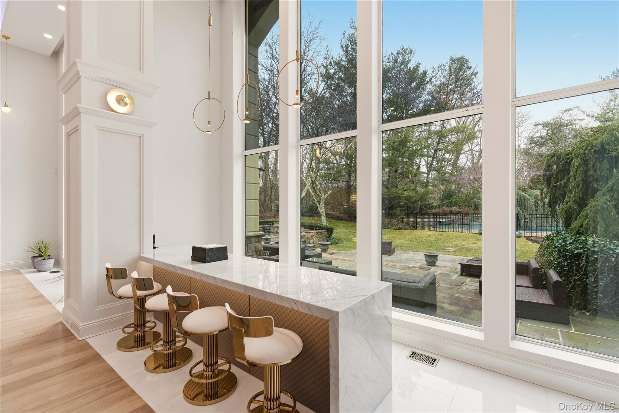 55 Coves Run Syosset, NY 11791 - Photo 10 of 50 a living room with furniture and a floor to ceiling window