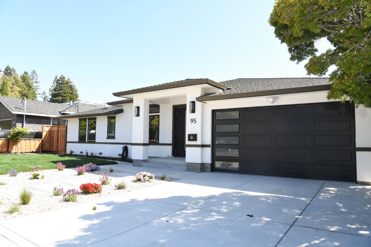 a front view of a house with a garage