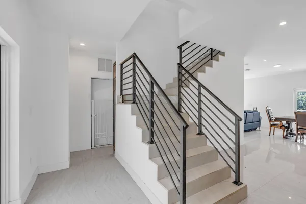 an entryway with a staircase